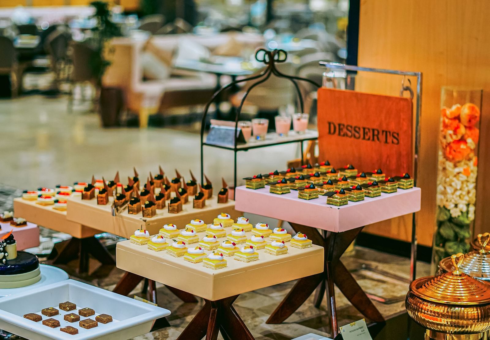 An appetising buffet spread with a variety of desserts neatly arranged on the table