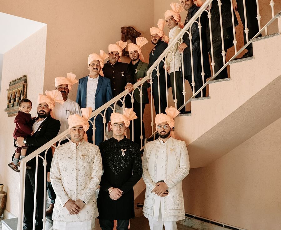 Wedding family portrait on the grand staircase of Umaid Palace.