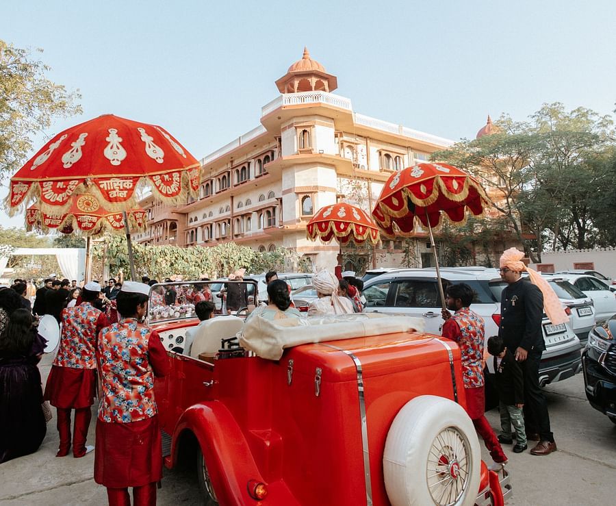 Groom’s grand entry on horse with traditional Indian wedding procession at Umaid palace.