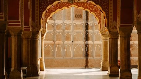 A vintage arch with sunlight passing through it