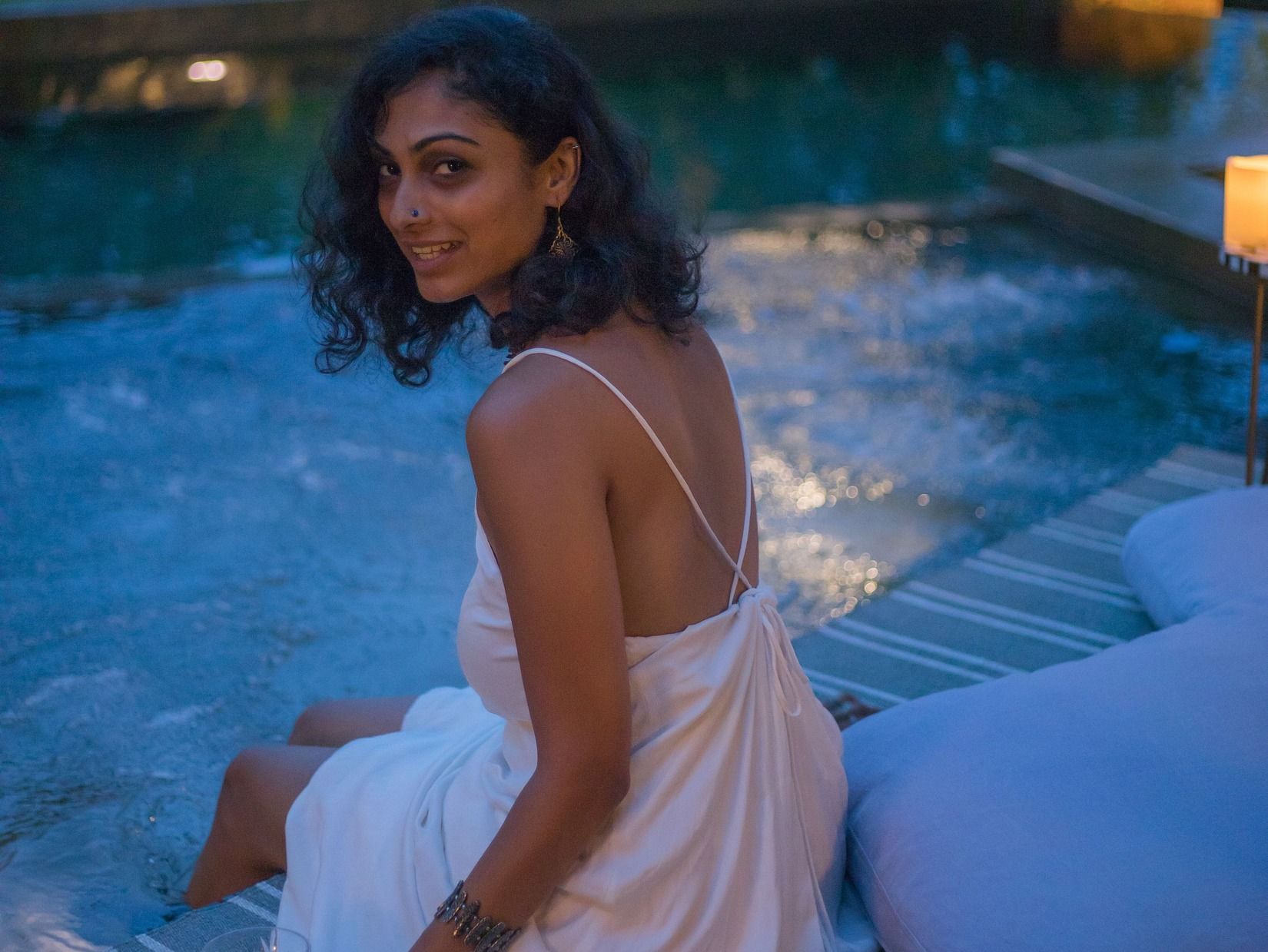 A bachelorette savouring a beverage by the pool