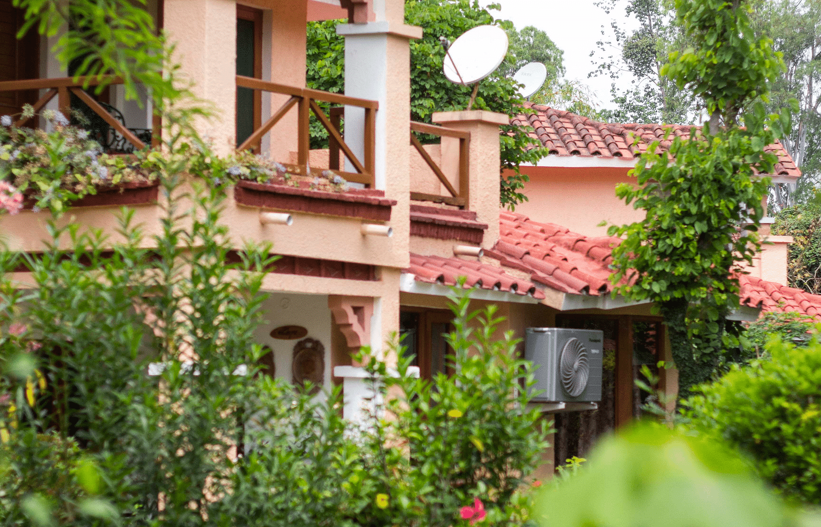 Building nestled amidst lush greenery, enhancing its tranquil surroundings.