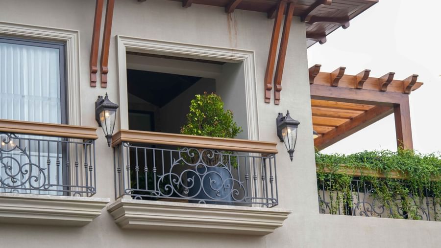 Close-up shot of the exterior of The Evren, Vagator's balconies with an overcast sky in the background.