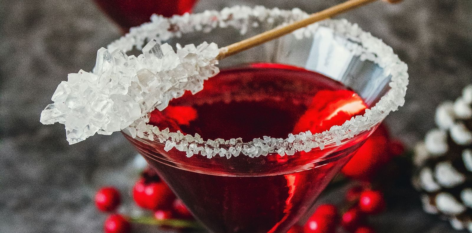 A drink in glasses garnished with white particles.