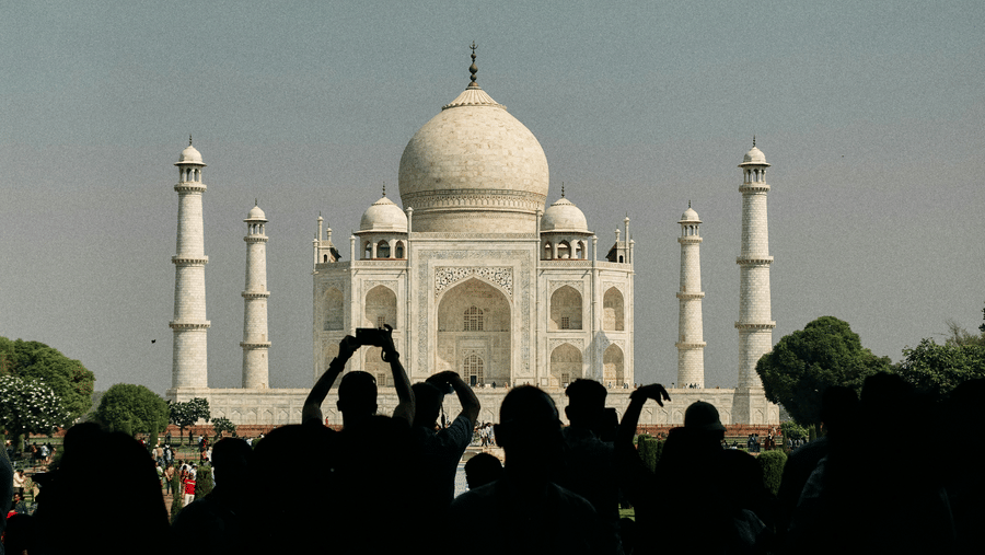 Taj Mahal seen amid the crowd from a distance