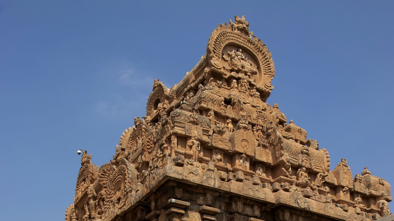 Ancient stone temple with intricate carvings and weathered architecture.