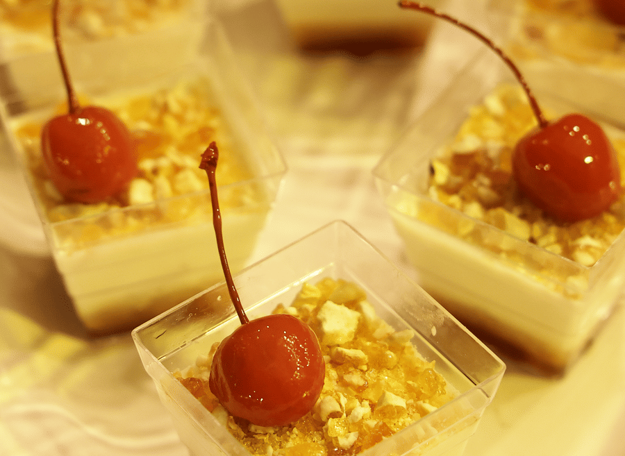 Individual dessert squares topped with cherries, served as part of a curated spread at The Sonnet.