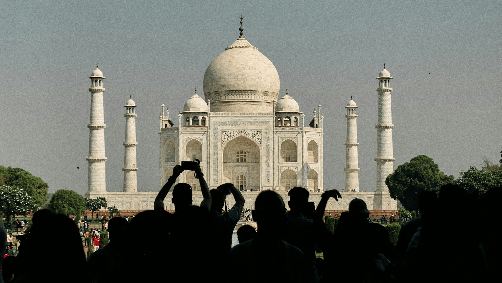 Taj Mahal seen amid the crowd from a distance