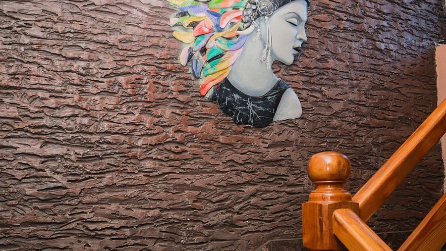 image of the staircase at dip holidays featuring a stone texture all with a modern graffiti on it 