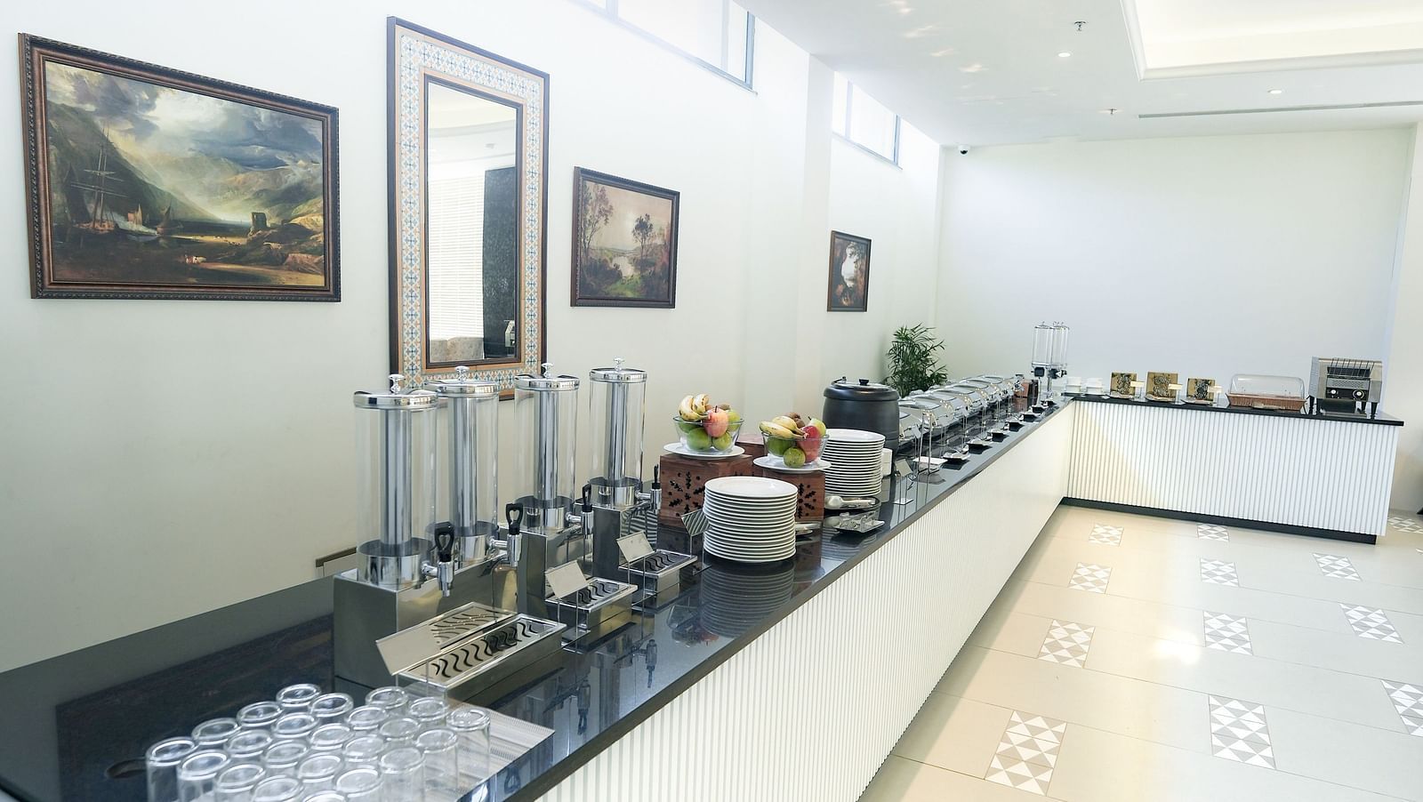 An image of a buffet area at our restaurant in Bankahandi with neatly arranged cutlery on the counter - NAMAMI BY ZENQ BANKHANDI