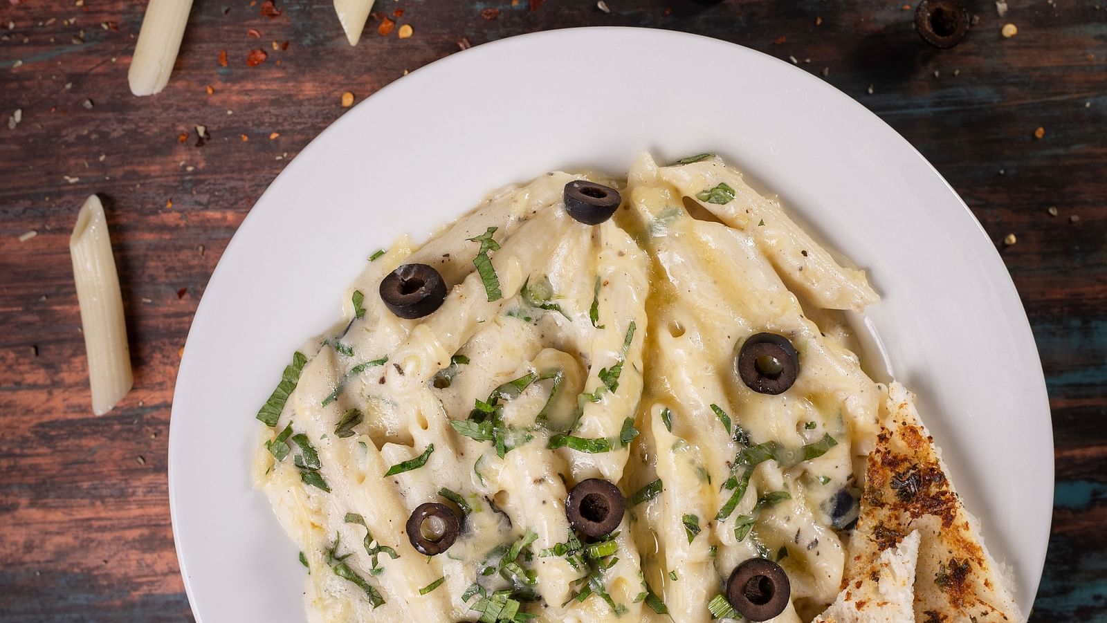 white sause pasta by the orange restaurant