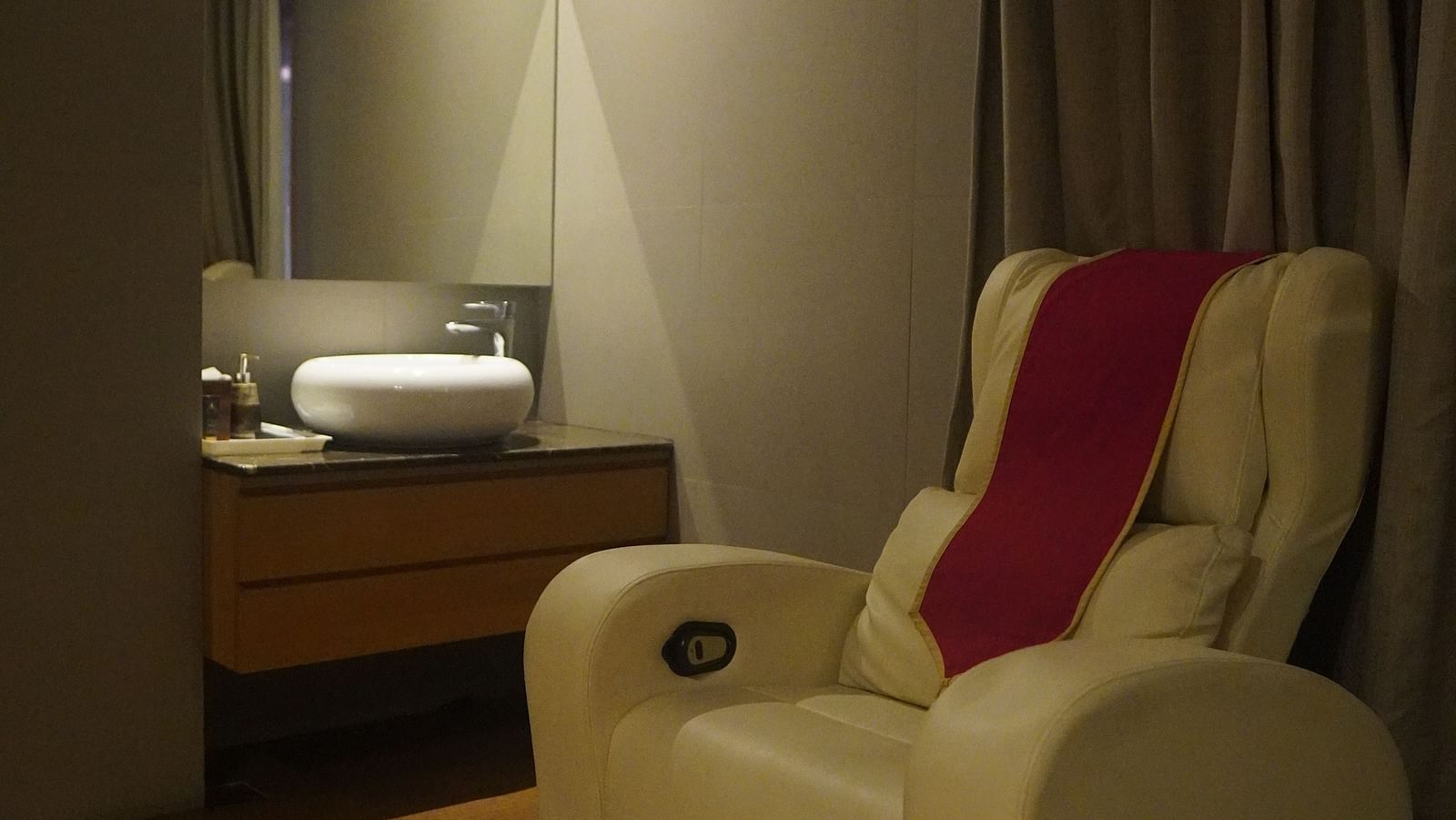 Massage sofa placed in front of a well-lit setting for relaxation