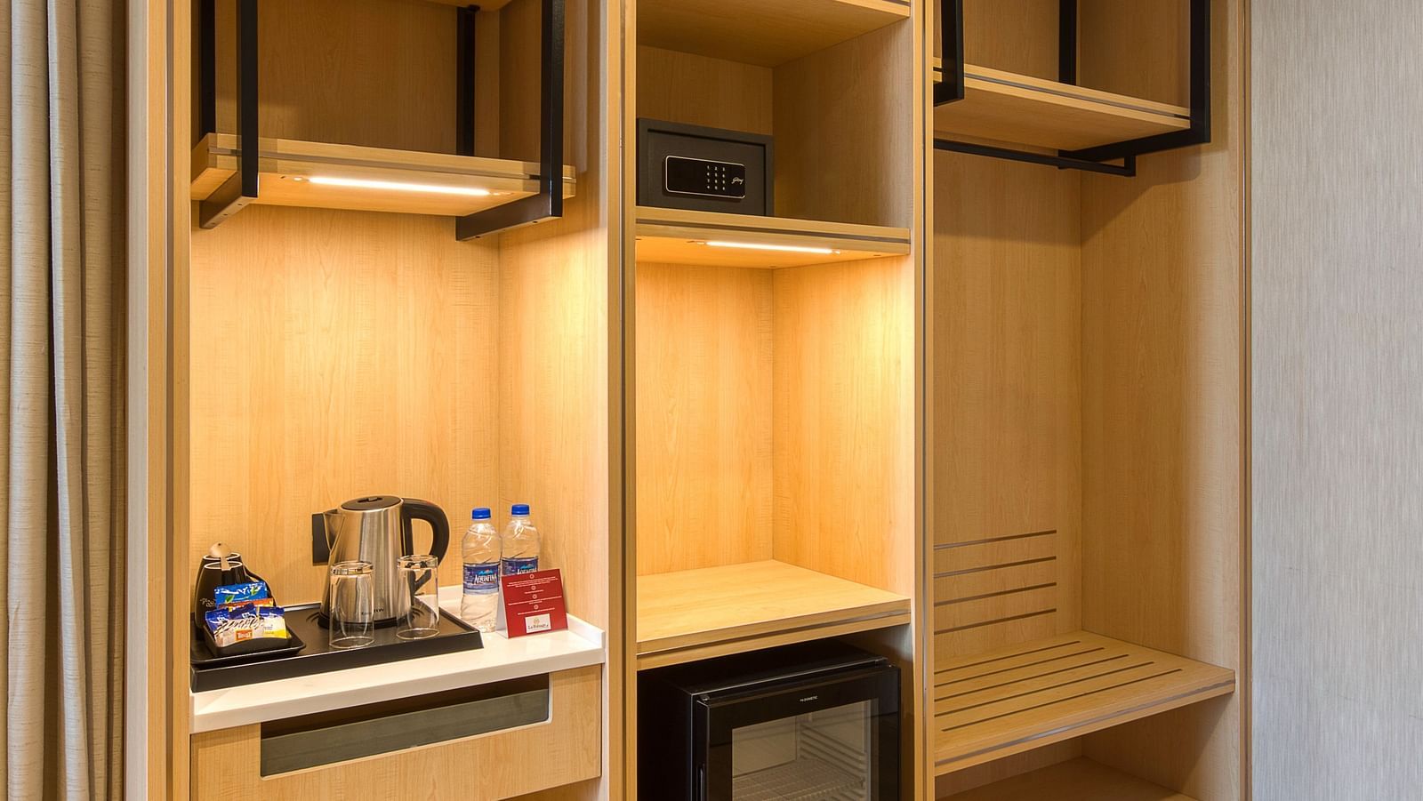 Shelf with the minibar at Sumo Suite at Le Foliage by TGI, Bangalore