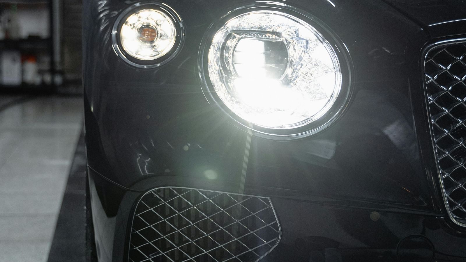  Front view of a black car parked.