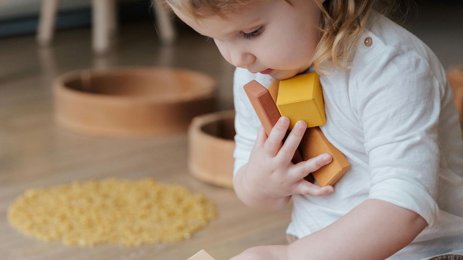An image of a kid playing with boxes