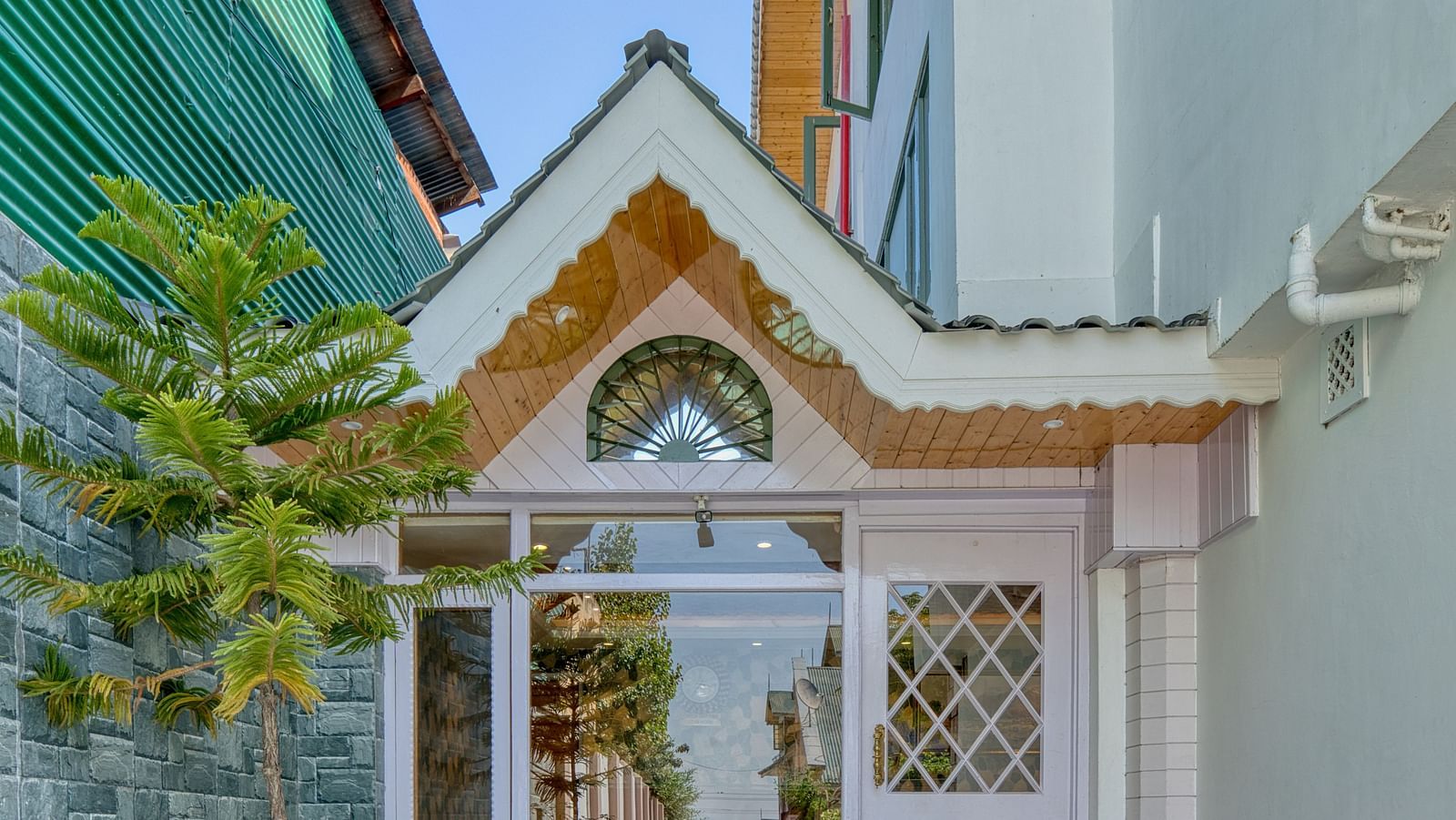 Outside view of Royal Comfort Regency entrance, with charming architecture and a welcoming front path.