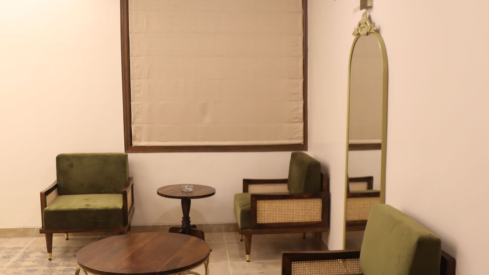 sofas and coffee tables in the living room of a Heritage Suite at Summer House, Nandi Hills