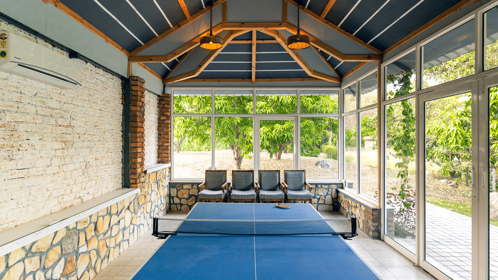 A table tennis table situated in an open room at the Sylvan Retreat, Dehradun.