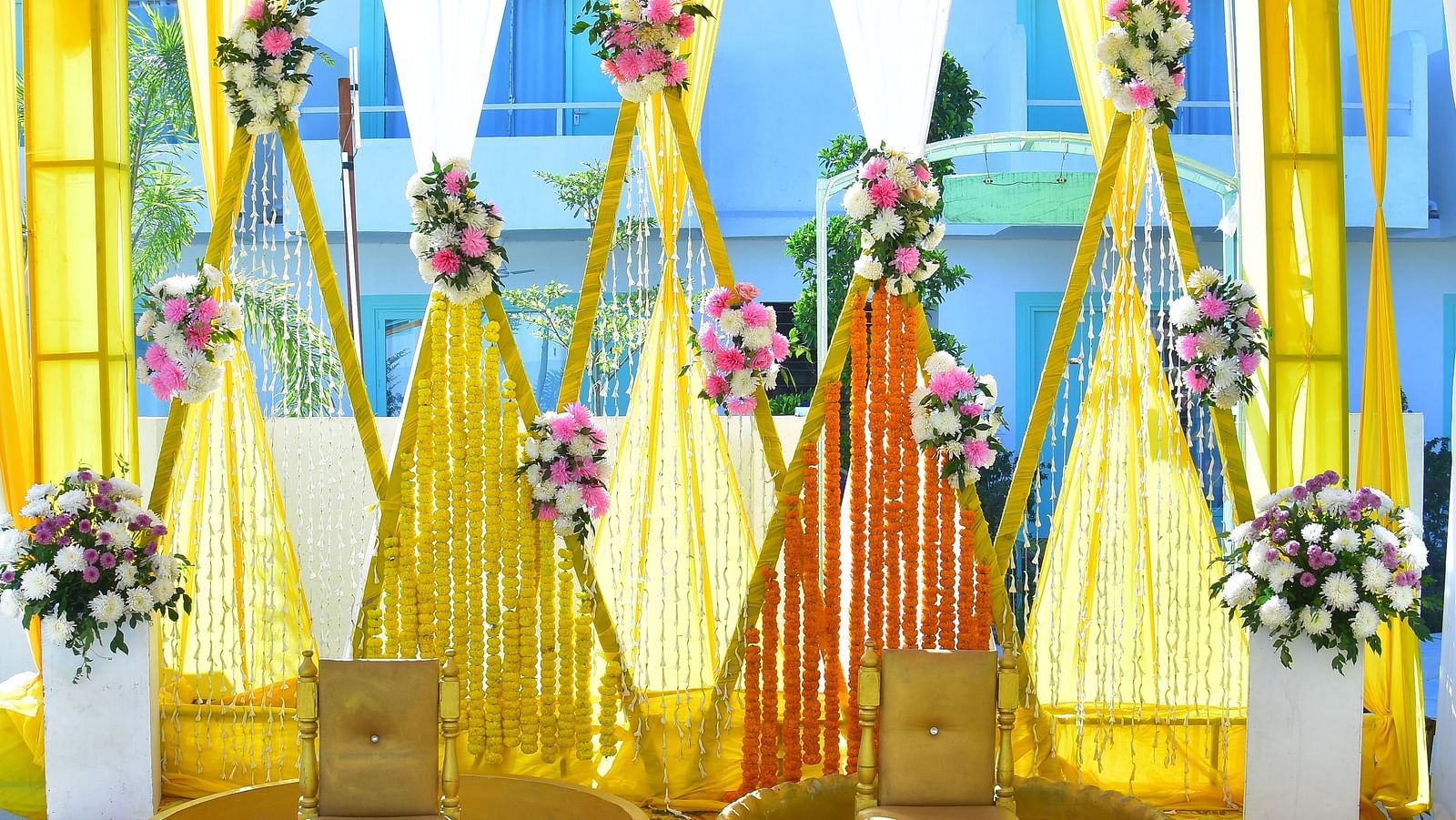 Traditional swing setup with yellow drapes for a mehendi ceremony at Vedikant Resorts The Mallard Corbett.