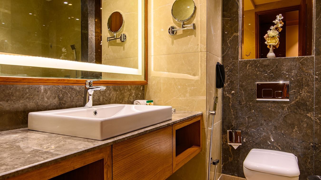 The interiors of a bathroom with a shower cubicle of one of the rooms in Pushkar at our 5-star resort 78