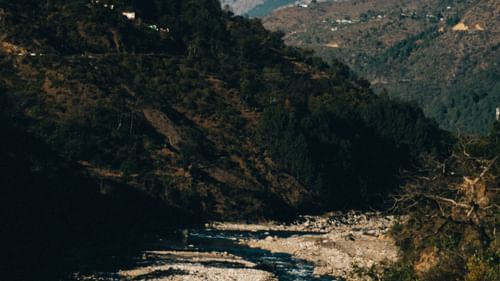 Aerial view of a stream flowing between the hills - Ramgarh Bungalows, Nainital.
