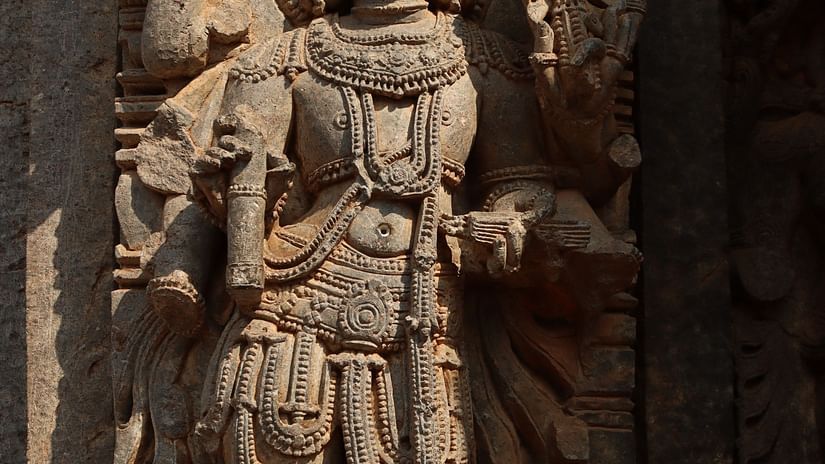 a stone carving of a mythical figure