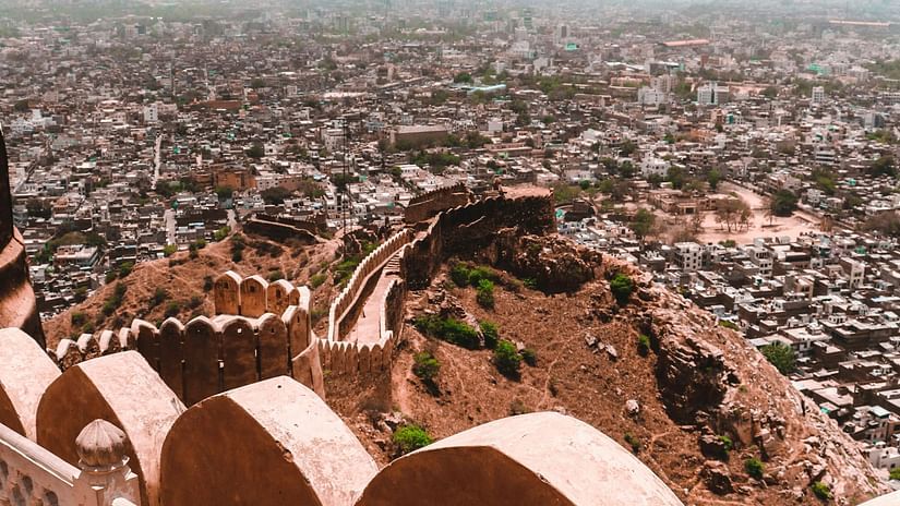 An image of a fort corridor with city vew
