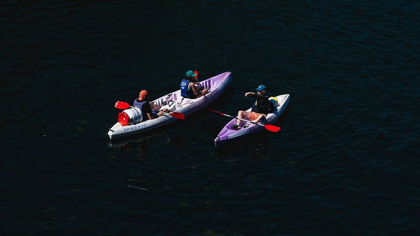 Two kayaks float away in the night - Night Kayaking Havelock