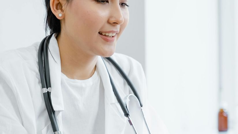 an image of a doctor looking at her laptop