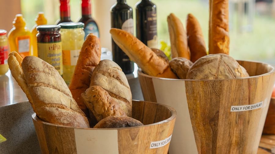 Close-up view of a bucket filled with breads and wines in the background at Ananta Spa and Resort, Ajabgarh
