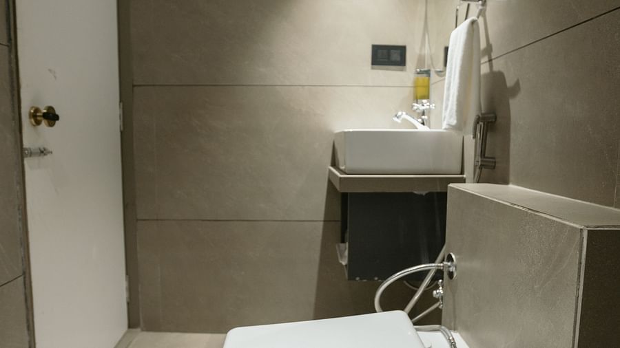 A clean and contemporary hotel toilet area with a washbasin and minimalist design - Biznotel By Pride Surat