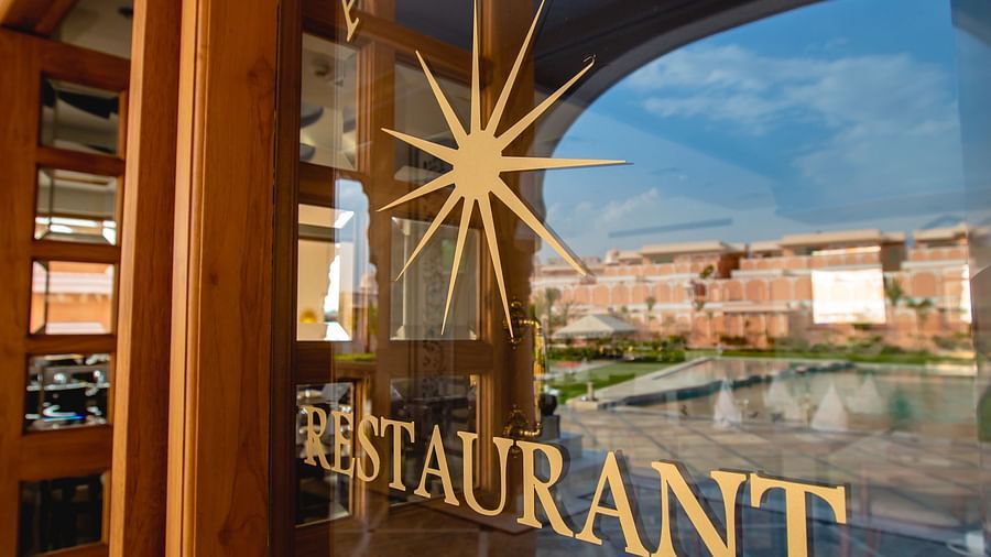 Buena Vista Luxury Garden Spa Resort - the name Aurora written on the glass door at the entrance of the restaurant