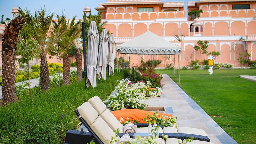 Buena Vista Luxury Garden Spa Resort - swimming pool beds kept beside the garden