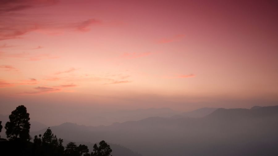  A mesmerizing sunset paints the sky with vibrant hues, creating a colorful and serene landscape, possibly a view captured from the resorts vantage point