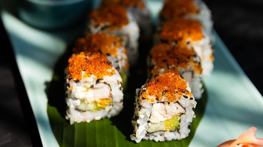 a plate of sushi and dip