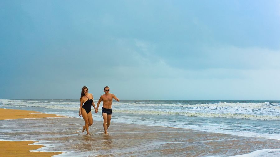 a couple walking on the beach