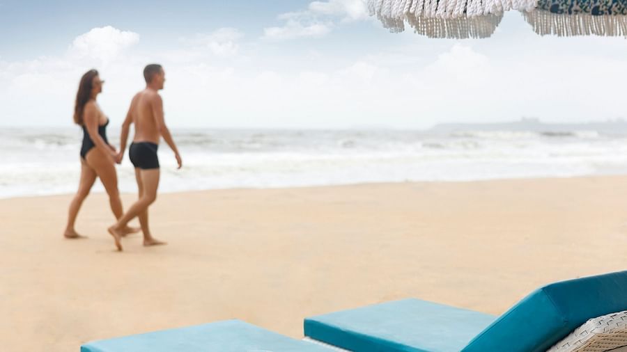 a couple walking on the beach