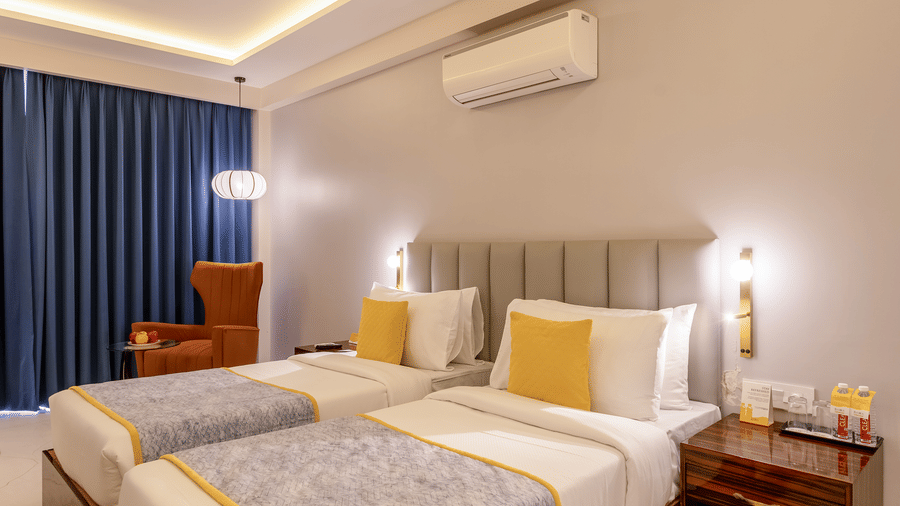 Interior view of a bedroom highlighting the tray ceiling with warm LED strip lighting and a ceiling fan.