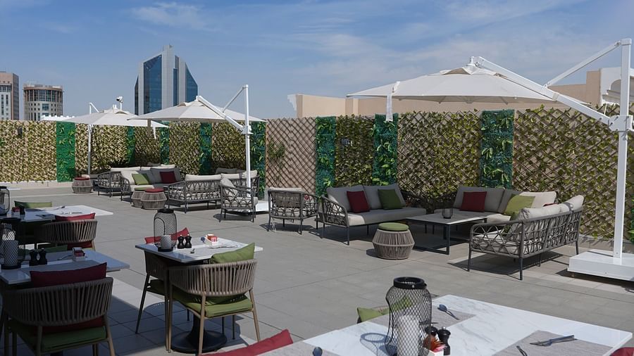 an overview of the al fresco seating at Le Patio - La Maison Hotel, Doha