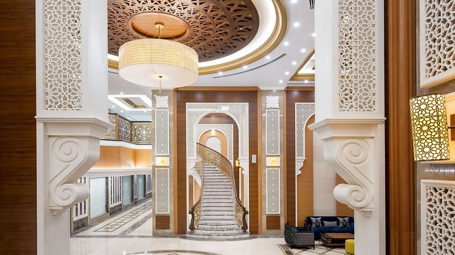 Overview of the Lobby area with a big chandelier in view - La Maison Hotel, Doha