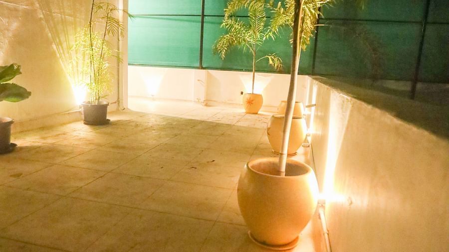 Terrace of the of la villas Heritage, pondicherry with flower pot and decorated with fairy light.