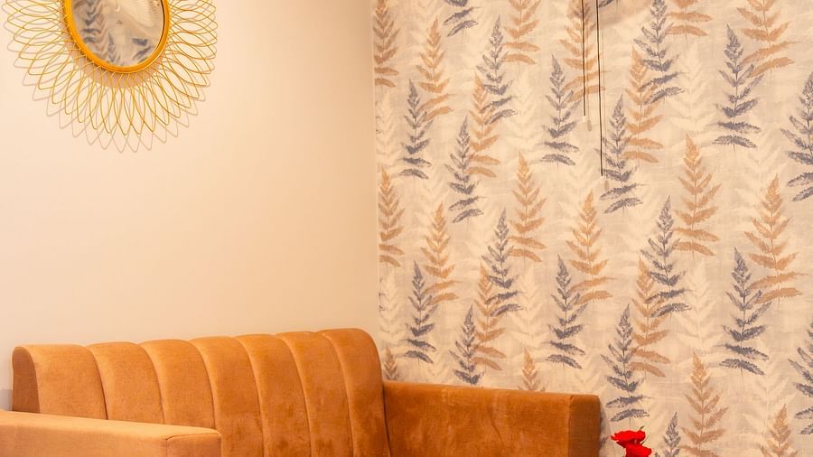 Living area of a Deluxe Room with comfortable sofas at Montclair Ananta, Elite.
