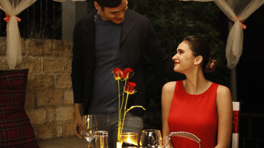 A man staring at a woman on a candle light dinner table - Polo Cherrapunjee Resort
