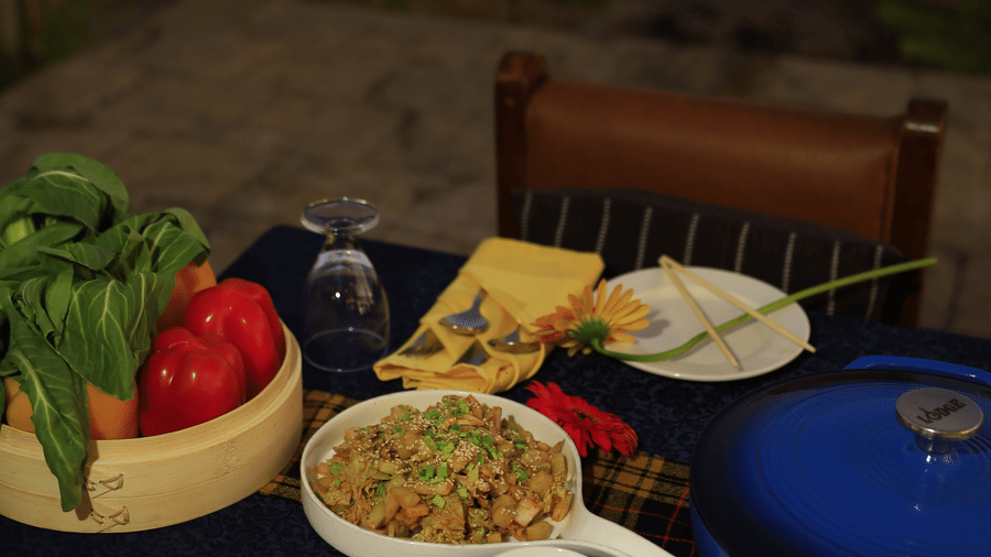 Various dishes placed on a dining table by the poolside - Polo Cherrapunjee Resort