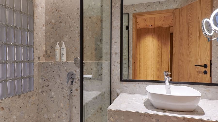 Image of a washroom with a separate shower area and modern amenities at The Dukes Retreat.