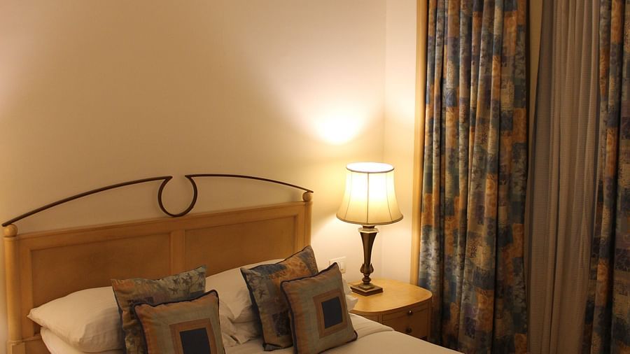 room with king size bed and warm lighting