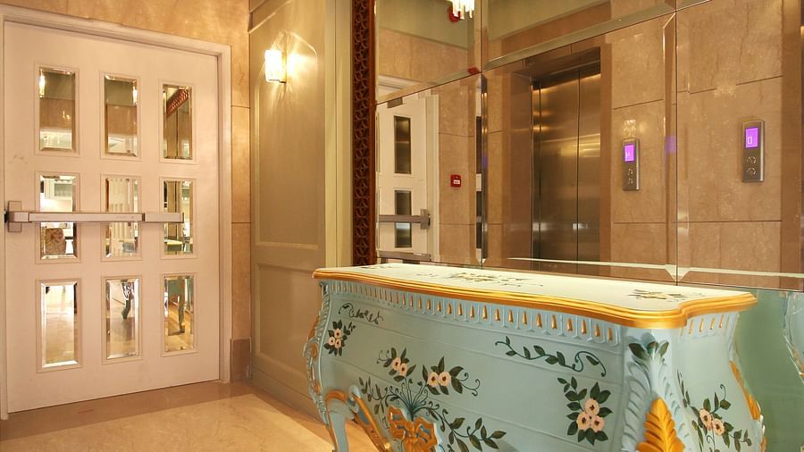 antique furniture and expansive mirror at theory9 bandra