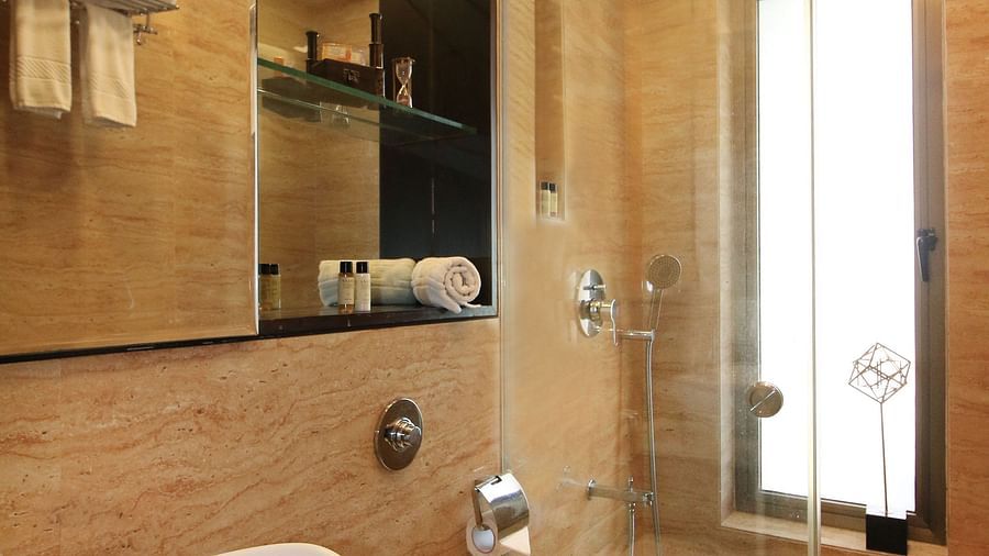 rooms with attached bathroom and toiletries at theory9 khar