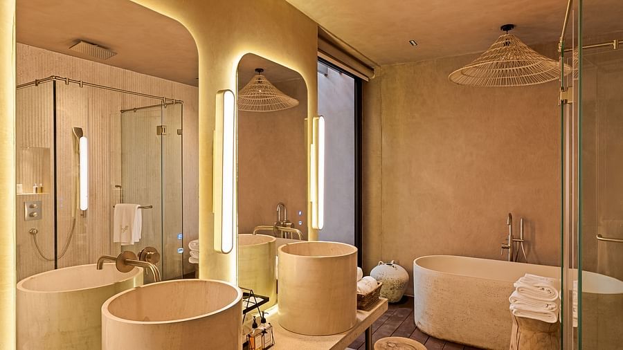 A well-lit bathroom vanity area at Villa Moira by V Escapes, with two sinks, large mirrors, and ample counter space for toiletries.