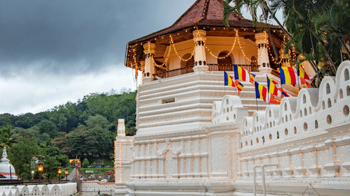 a white exterior facade of a temple